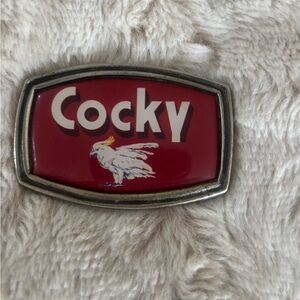 Red Cocky Enamel belt buckle.  No strap.